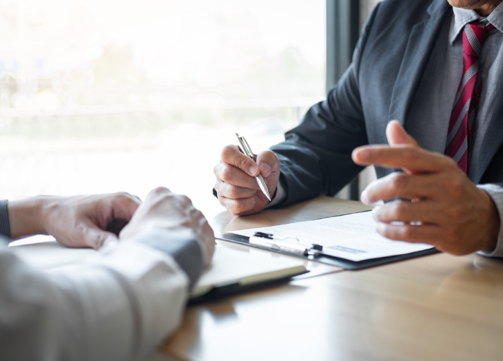 Two hands at a business meeting