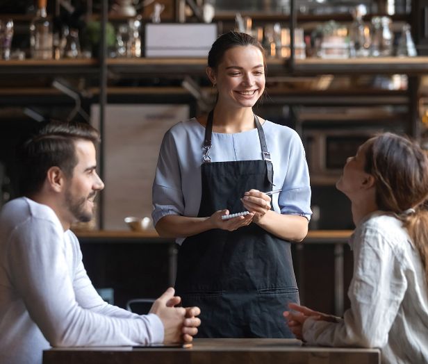 Waitress serving two people