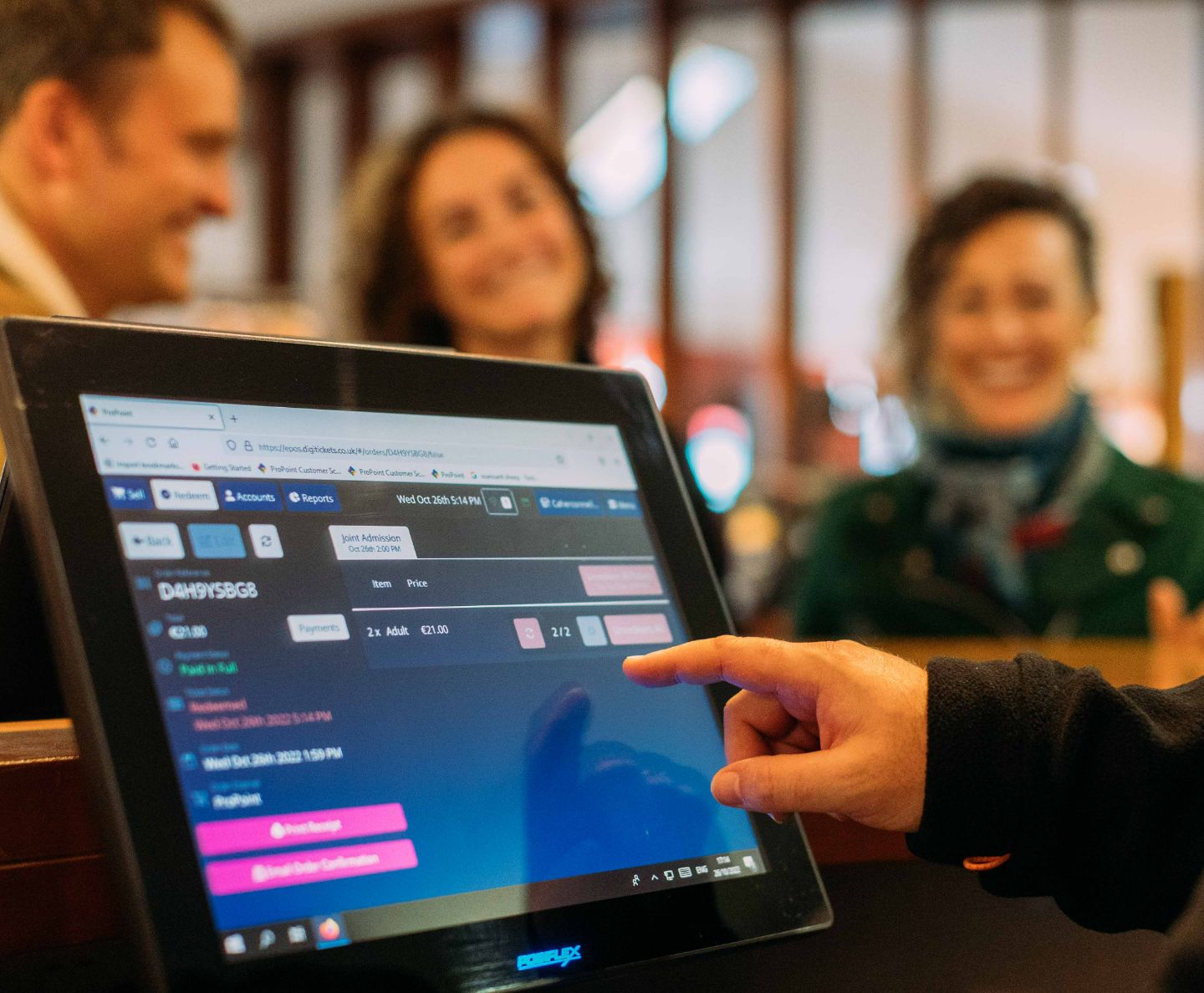 A hand picking options on a touchscreen