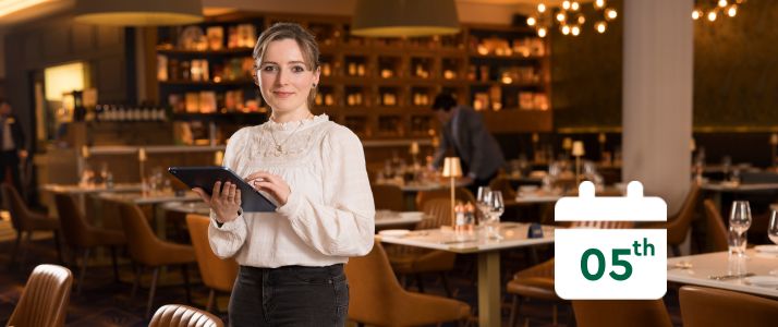 Woman holding tablet, calendar icon reads 5th