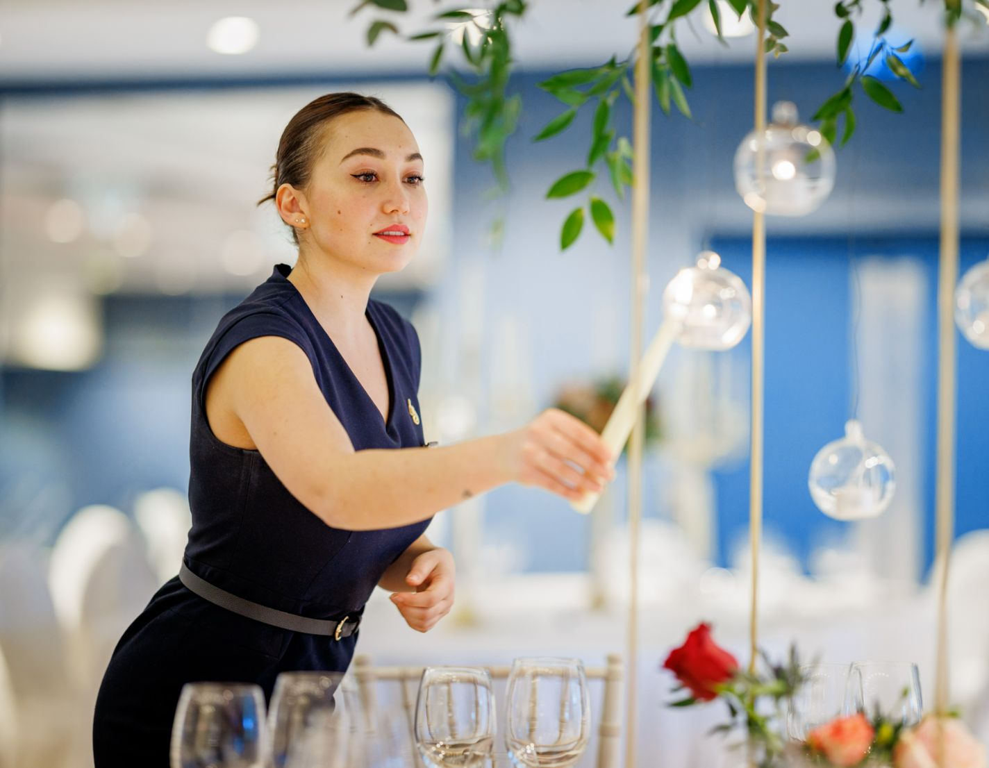 A lady setting a table