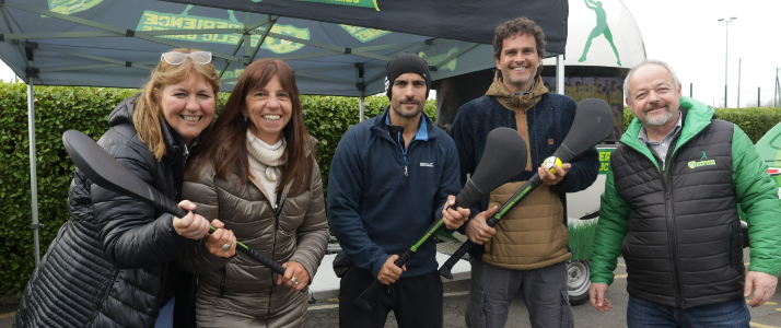 People standing around with hurls