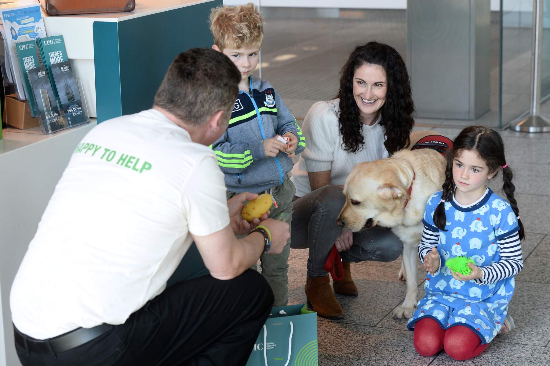 Three people and a dog