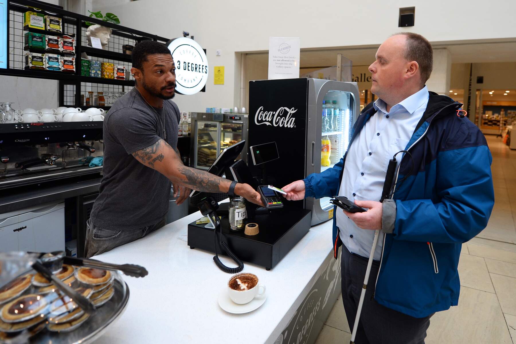 Man paying for food at till