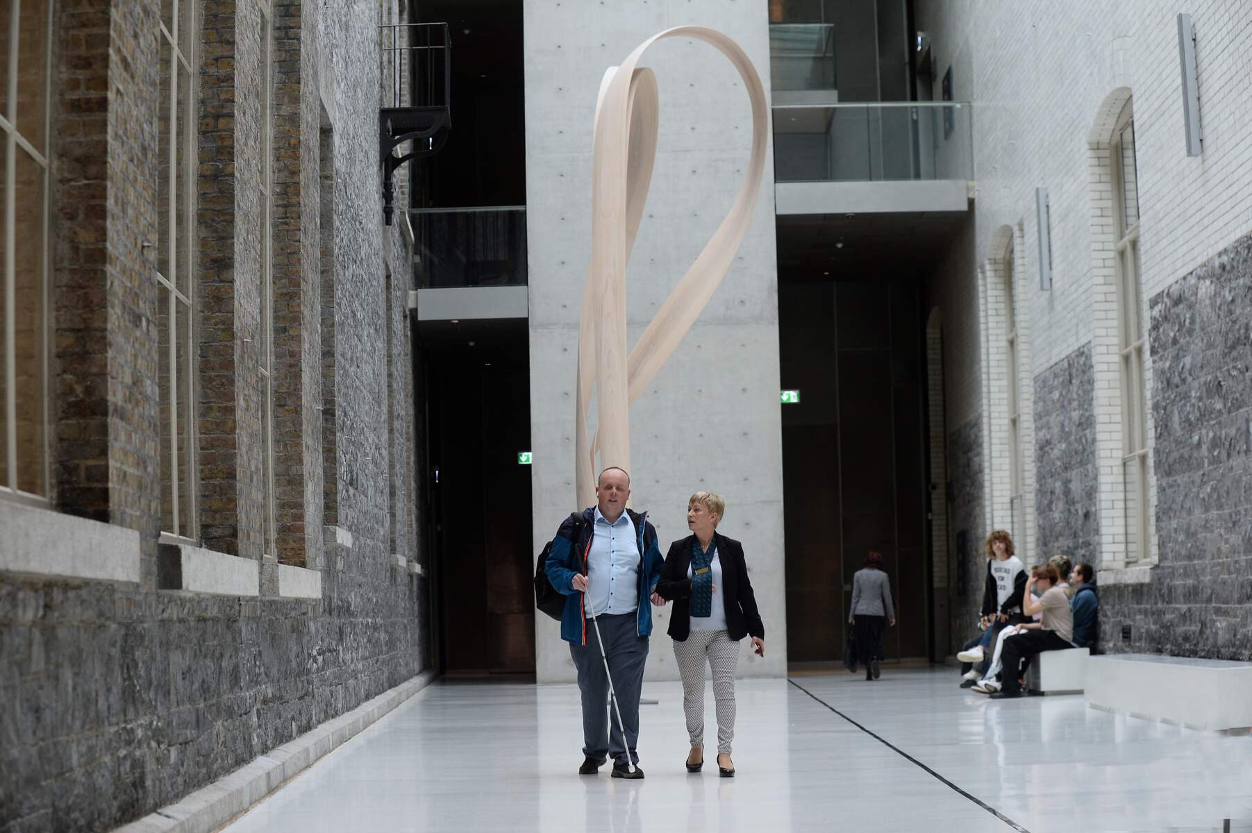 Two people walking through national gallery