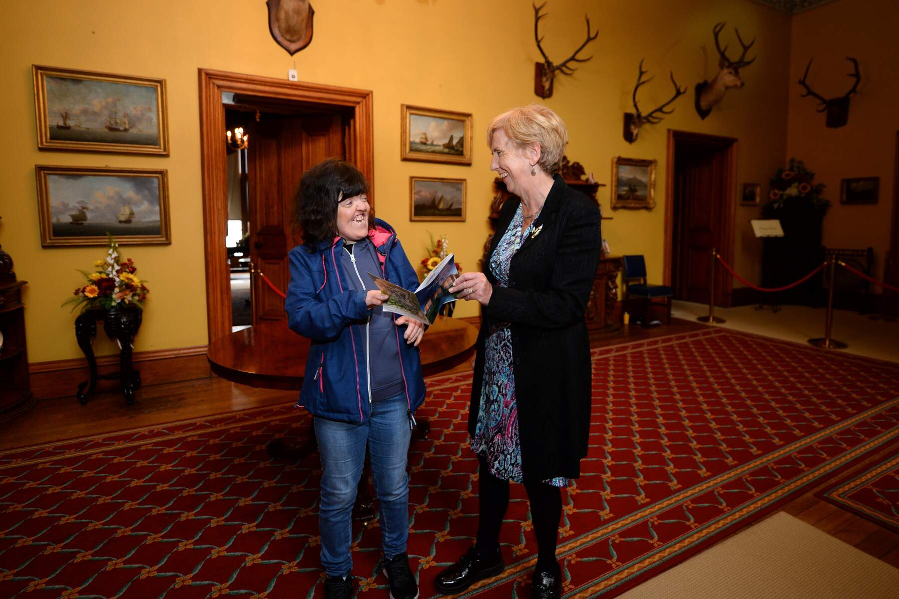 Two women talking in a hotel