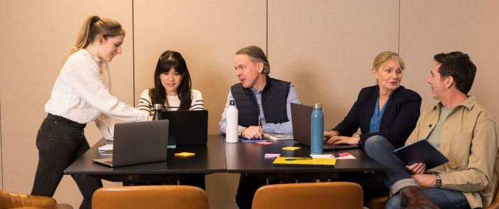 Group of colleagues discussing at a table