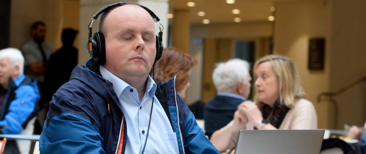 Man typing on a computer in the national gallery