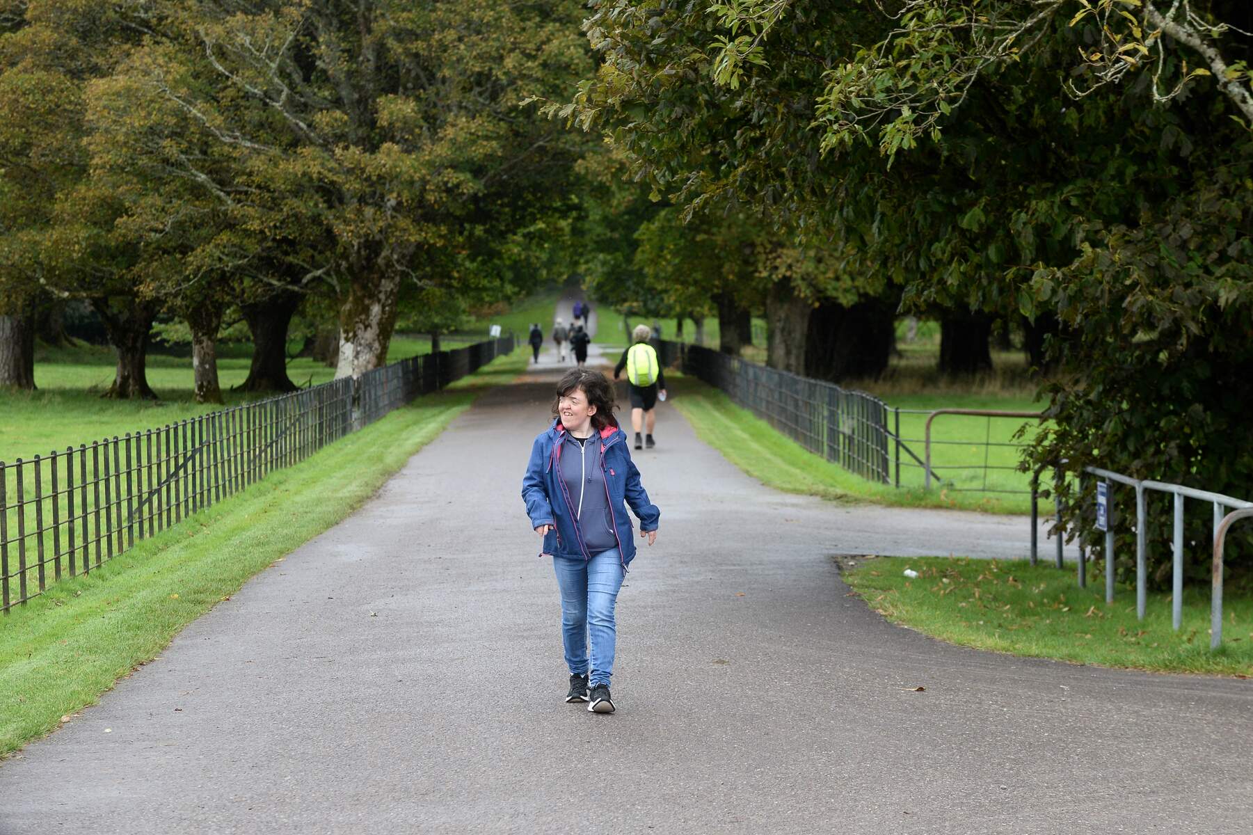 Woman walking through a park at Muckross House in Co.Kerry