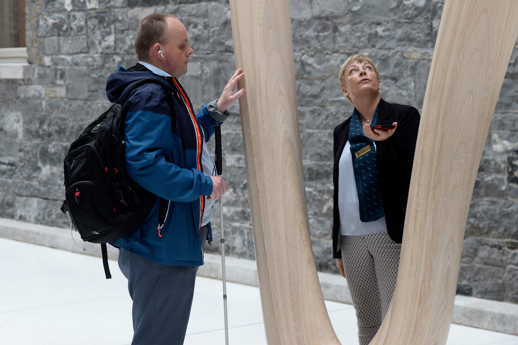 Man in the national gallery on a tour with a female tour guide