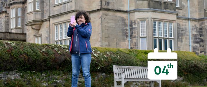 Woman taking picture, calendar icon reads 4th