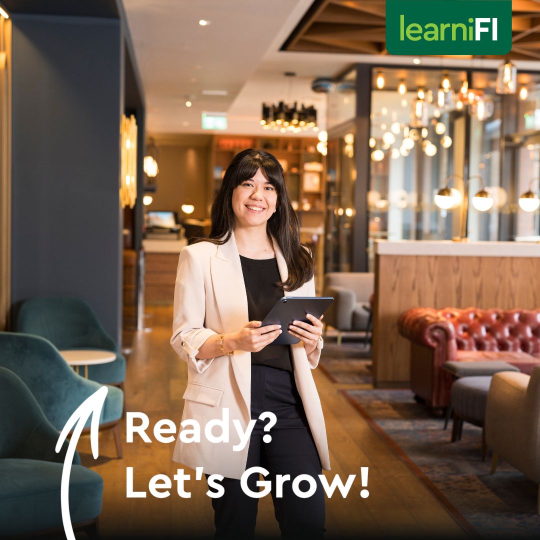 Woman in a hotel holding a tablet