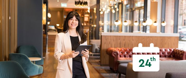 Woman holding tablet, calendar icon reads 24th