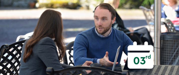 Two colleagues discussing, calendar icon says 3rd
